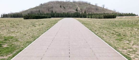 Tree-covered hill Hanyang Mausoleum with winding path and sparse grass creating serene atmosphere - Forever Legacy premium custom mausoleums USA, expert craftsmanship guarantee.